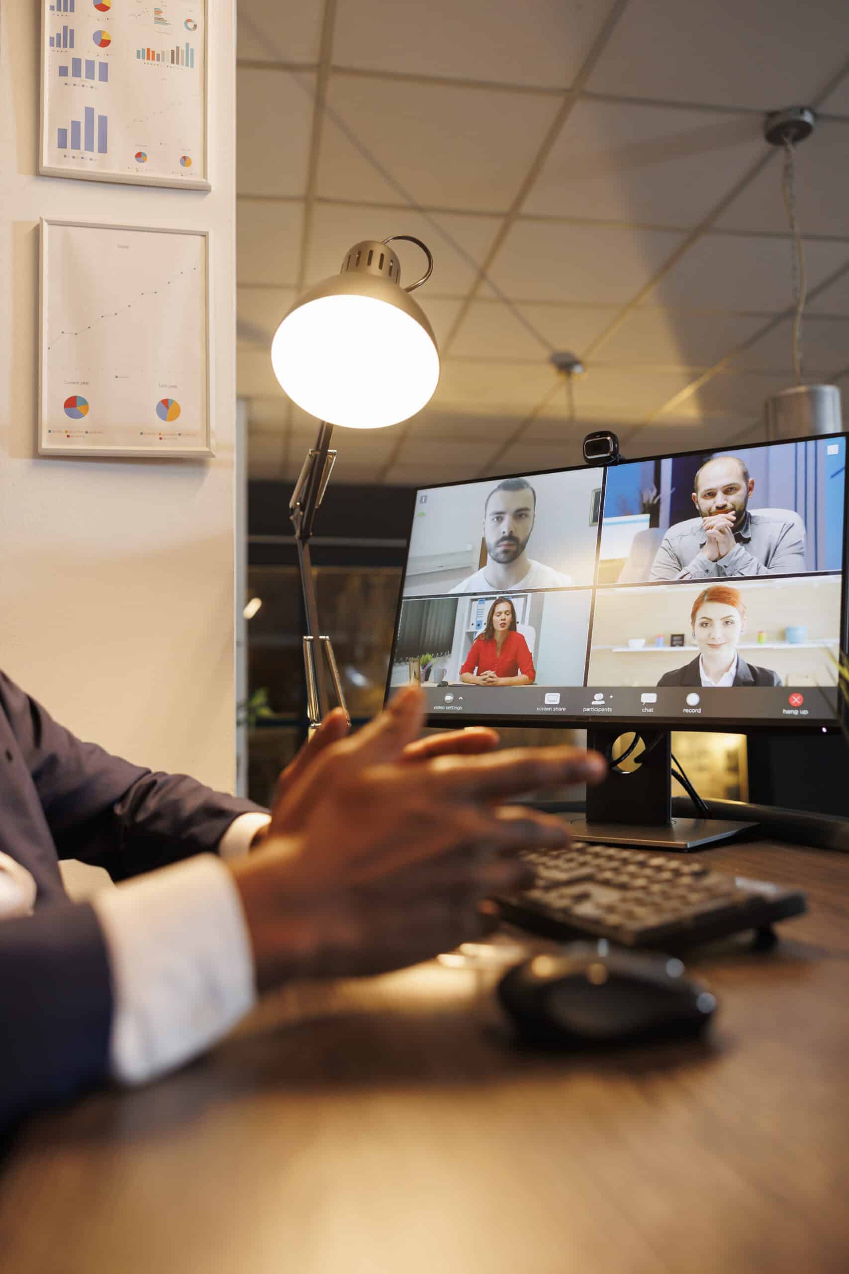 entrepreneur discussing financial statistics with remote team